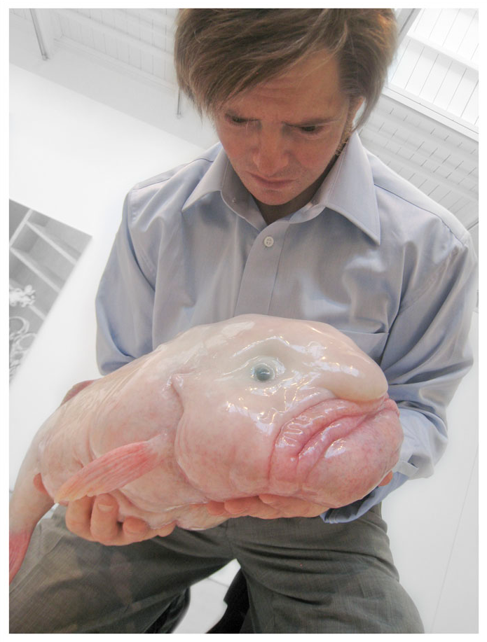 Creepy guy holding a fish